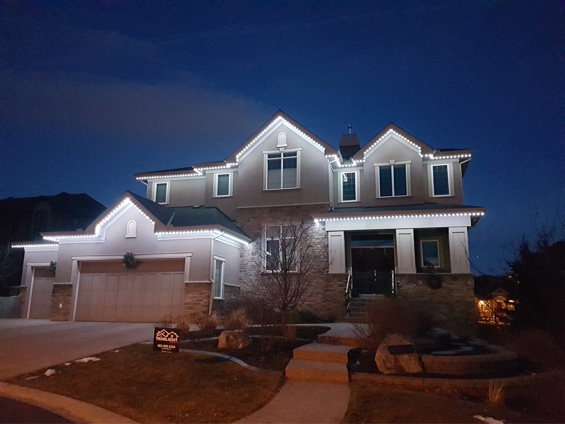 Permanent outdoor LED track lighting on home soffit - multicolour display by Forever Lights